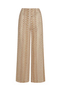 Front view of Toulon Pant in Porto Cervo Gold showcasing fitted crochet knit and sheer zigzag pattern on white background