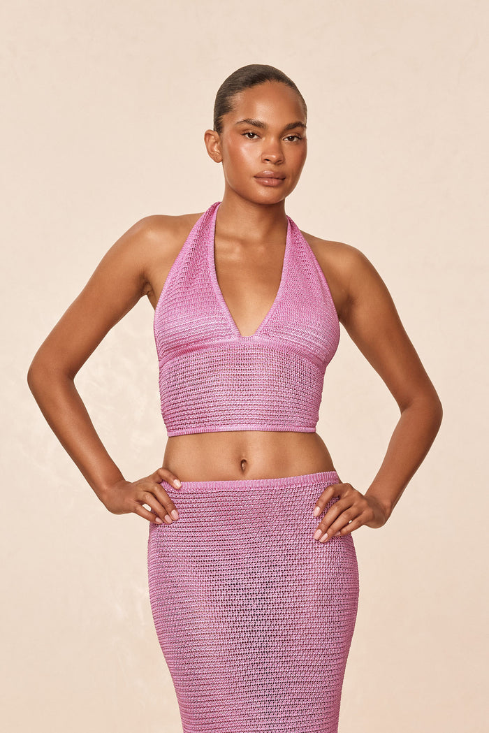 Front view of Toulon Top in Moonlight treble knit showcasing halter V-neck, crop fit, and knit texture with adjustable neck and back ties on a neutral beige studio background