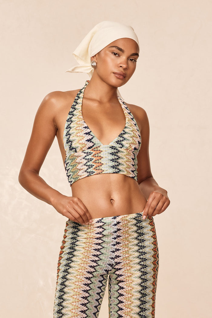 Front view of Toulon Top - Porto Cervo Multi showing V-neck halter and textured multicolor zigzag knit on beige background