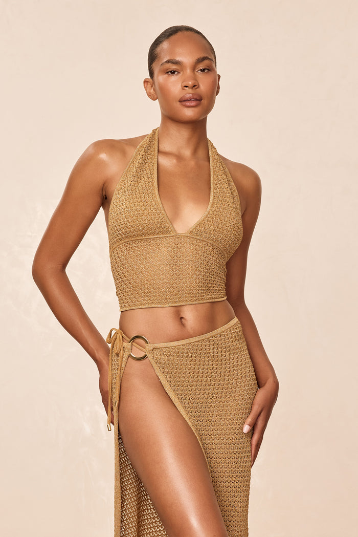 Front view of Toulon Top Lined in Antique Gold lace crochet showing halter neckline and lined crochet texture on model