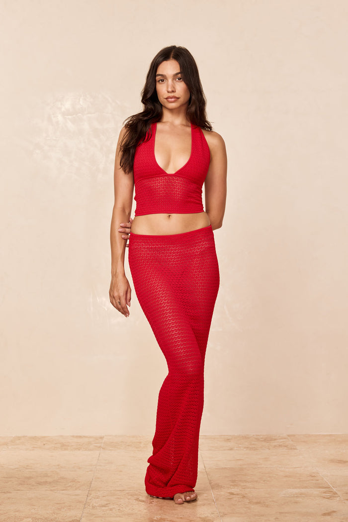 Front view of Toulon Top Lined in Chili Pepper crochet showing deep V halter and cropped fit with beige studio background