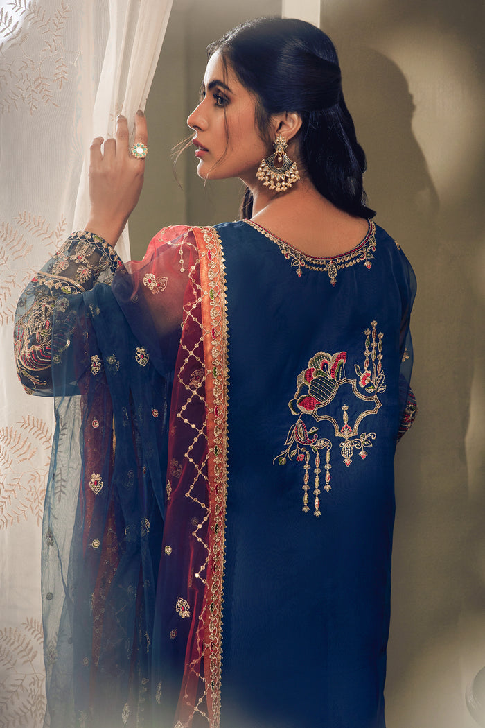 Back profile of Tropicana outfit showing embroidered back motif and contrast dupatta drape