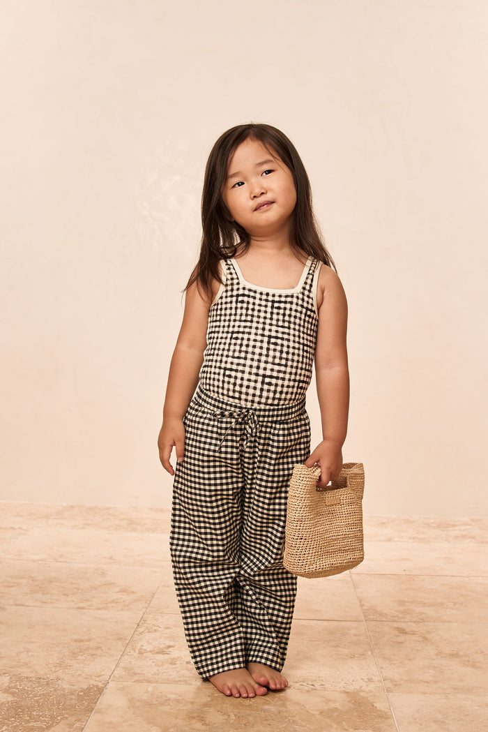 Front view of Tuscany Pant Kids in black gingham showing smocked waistband and wide leg on neutral background