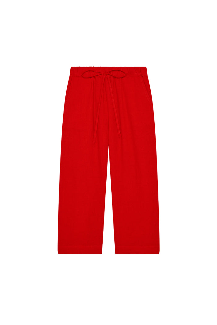 Flat lay of Tuscany Pant Kids in Chili Pepper showing drawstring waist and wide-leg fit on white background