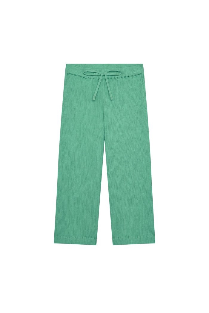 Front view of Tuscany Pant Kids in Pond crinkle, showing smocked drawstring waistband, crinkled fabric texture and flare legs on white background