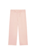 Flat lay of Tuscany Pant Kids powder pink crinkle showing smocked waistband, drawstring tie, and wide flare legs on white