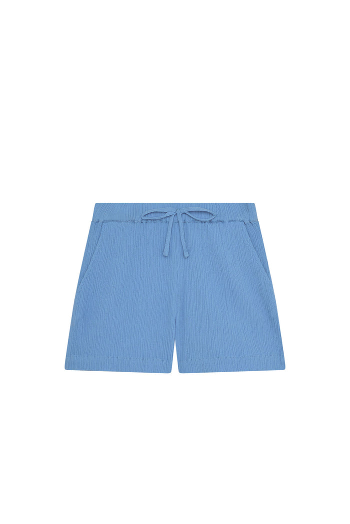 Front view of Tuscany Short Kids shorts in Azure Crinkle showing elastic drawstring waistband and textured fabric on white