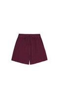 Front view of kids' Tuscany shorts in fig showing elastic waist with faux tie, crinkled fabric and side pockets on white