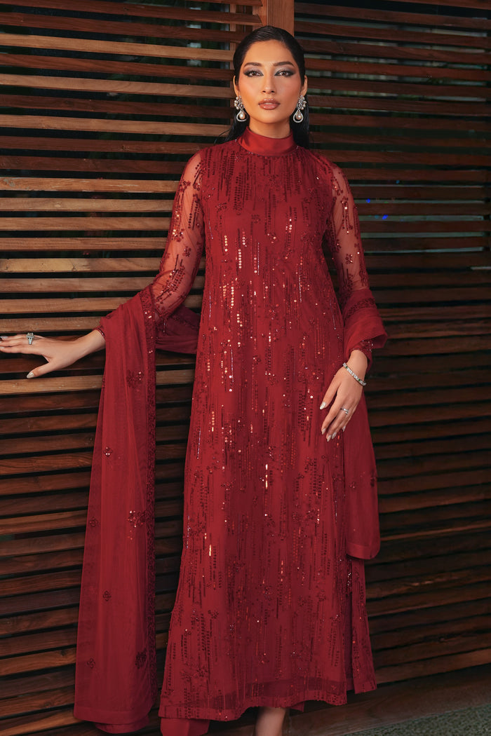 Side view of NAQSHI Valentina rose red formal outfit highlighting soft net dupatta, side slit detail, hanging accents, and clean straight fit.