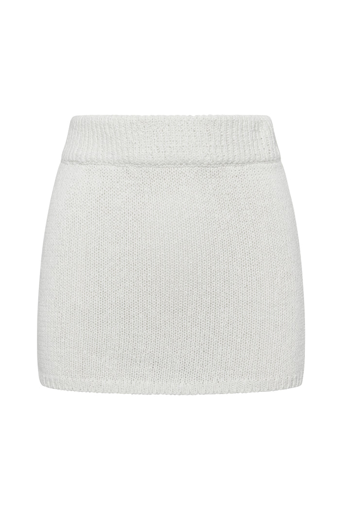 Front view of Venice skirt in white showcasing ribbed waistband and crochet knit texture on white background