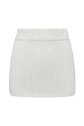 Front view of Venice skirt in white showcasing ribbed waistband and crochet knit texture on white background