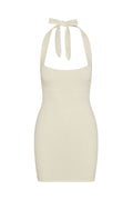 Front view of Waikiki Mini Dress in ivory lace crochet showing halter tie neck and textured crochet fabric on white background
