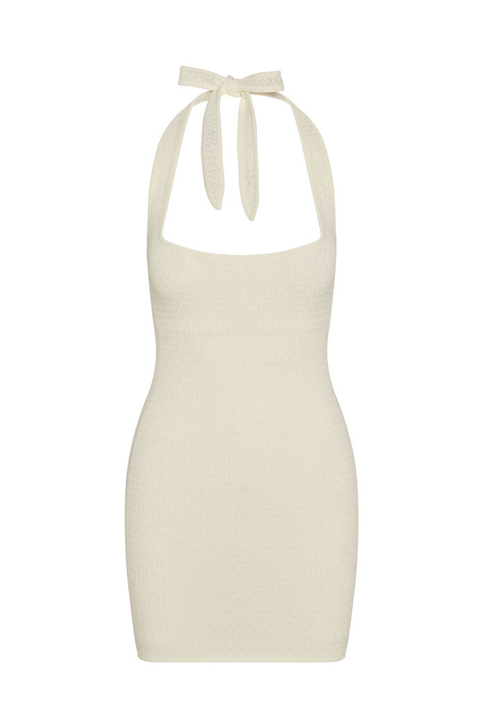 Front view of Waikiki Mini Dress in ivory lace crochet showing halter tie neck and textured crochet fabric on white background