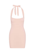 Front view of Waikiki Mini Dress in powder pink lace crochet showing scoop neckline with tie halter and fitted silhouette on white background