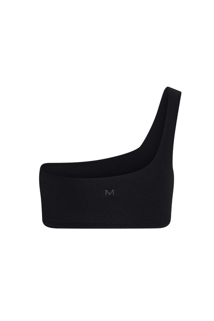 Black one-shoulder sports bra with small M logo centered on front