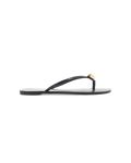 Black flat thong sandal, side view with thin strap and gold teardrop ornament at toe.