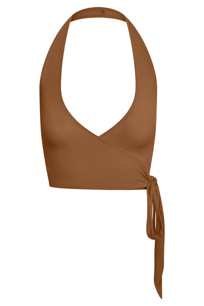 Close up front of Yosemite Sleeveless Top in Caramel Lightweight Rib showing halter wrap V neck and side tie on white