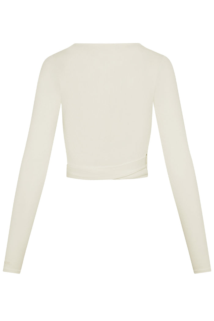 Back view of Yosemite Top in Ivory Rib showcasing ribbed long sleeves and wrap-tie waist on white background