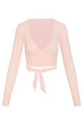 Front view of Yosemite Top in powder pink rib, cropped wrap V-neck with long sleeves and tie-waist bow on white background