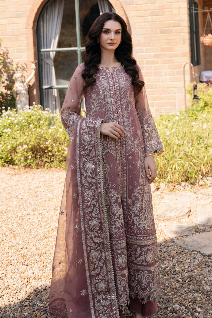 Tea pink organza gown style shirt by NAQSHI with open slit, crystal loop details, heavy embroidery, culotte trousers, and matching dupatta for formal events.