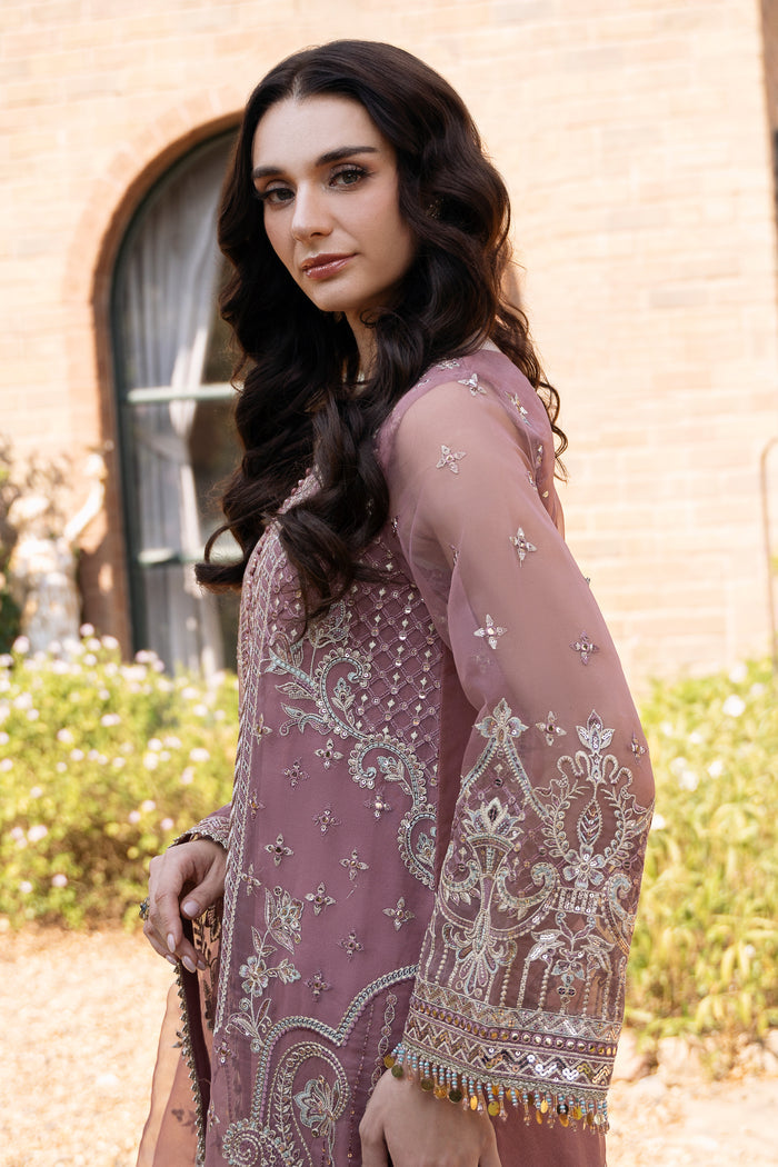 Side close view of NAQSHI Zaha tea pink outfit showing crystal sleeve hangings, organza texture, and refined formal finish.
