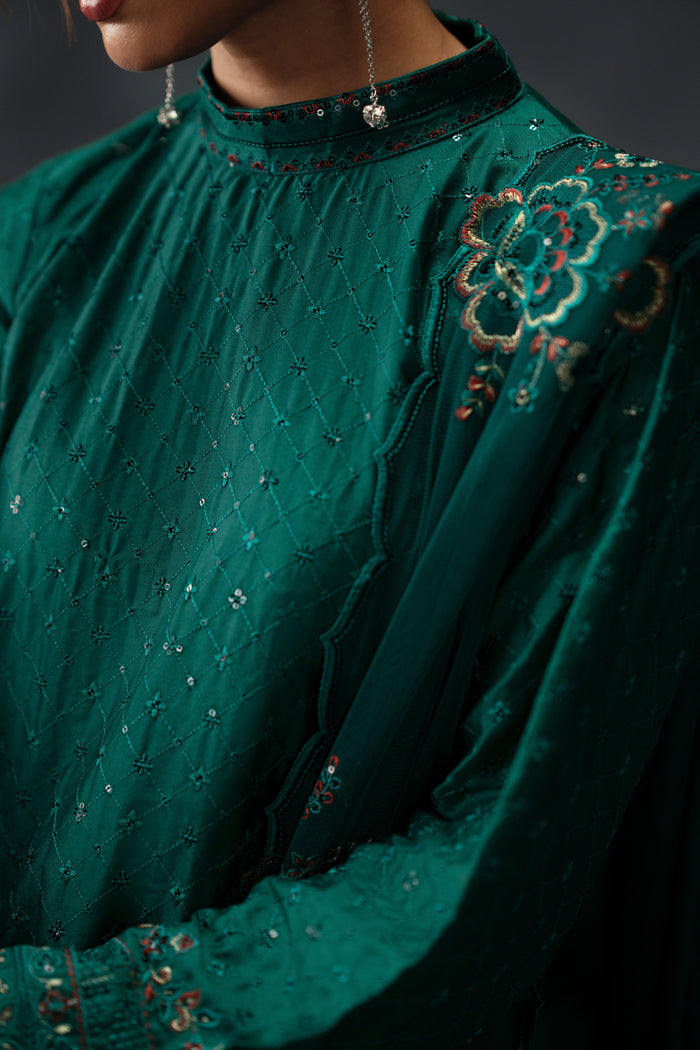Close up of NAQSHI Zahra embroidered neckline and sleeve detail on emerald green ready-to-wear dress for formal occasions
