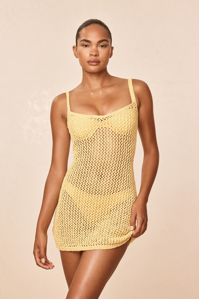 Front of Zanzibar Mini Dress - Meyer Petit Crochet, yellow open-knit sheer with slim straps and V neckline on beige background