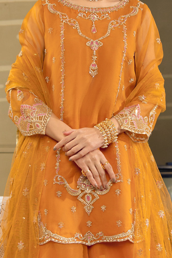 Close-up of NAQSHI Zaryaab short shirt showing embroidery, cutwork details, and fine organza finishing
