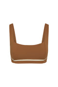 Front close-up of Zion Bra in caramel with ivory trim showing square neckline, wide straps, contour seaming, and underbust support on a white background