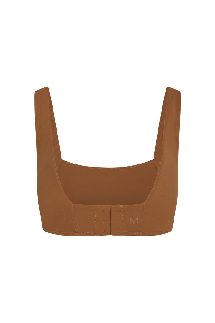 Front view of Zion Bra in caramel/ivory with square neckline, wide straps and three-hook closure on white background