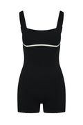 Front view of Zion Romper in Black/Ivory showcasing square neckline and contrast ivory underbust piping on white background