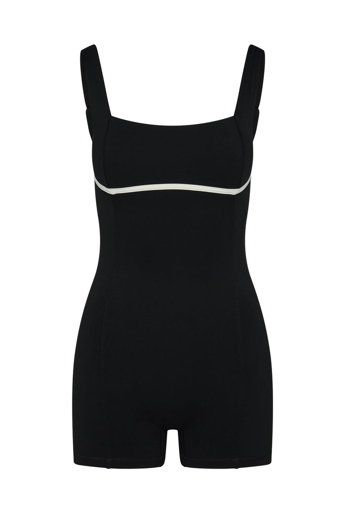 Front view of Zion Romper in Black/Ivory showcasing square neckline and contrast ivory underbust piping on white background