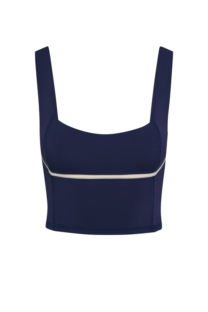 Front view of Zion Tank in Midnight showing square neckline, wide shoulder straps, and ivory contrast piping on white background