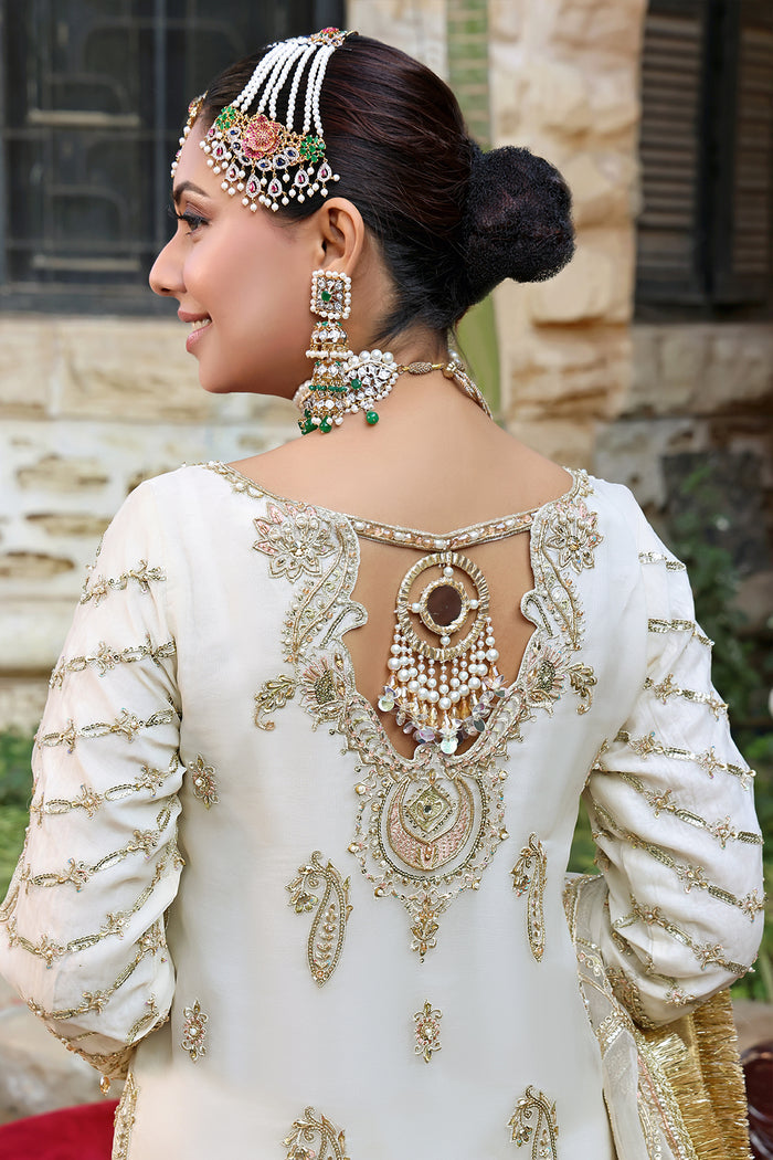 Naqshi Zonar organza dupatta elegantly draped to present intricate jal-motif embroidery, sequin sprays, and four‑sided kiran-lace border.